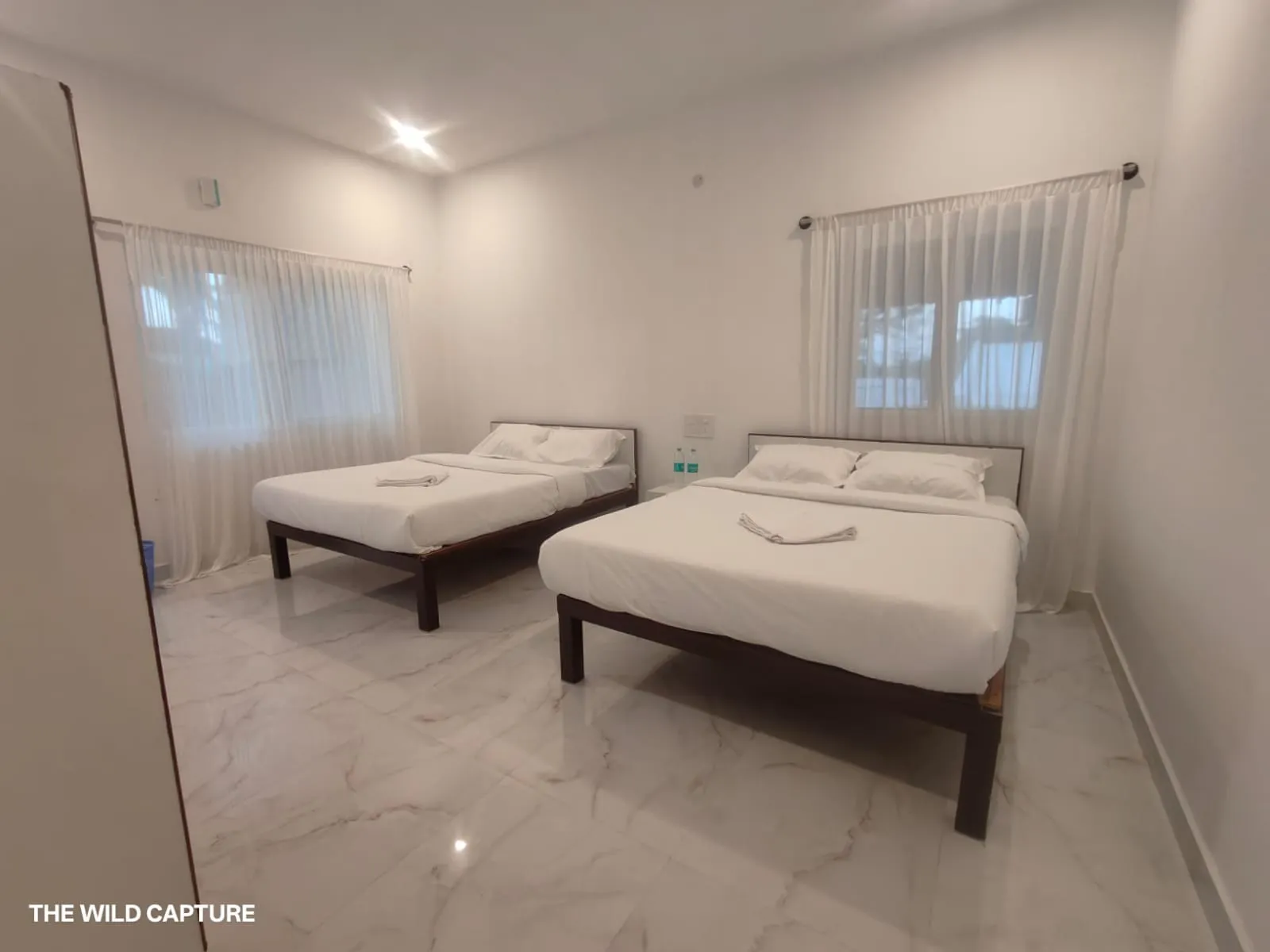 Guest room made up with fresh white linen